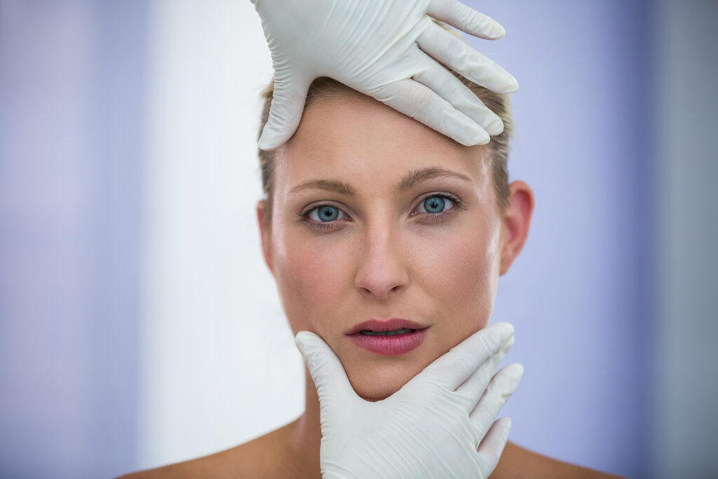 Medical Tourism in Turkey – Compare & Book the Best Hospitals 6 Doctor examining female patients face from cosmetic treatment